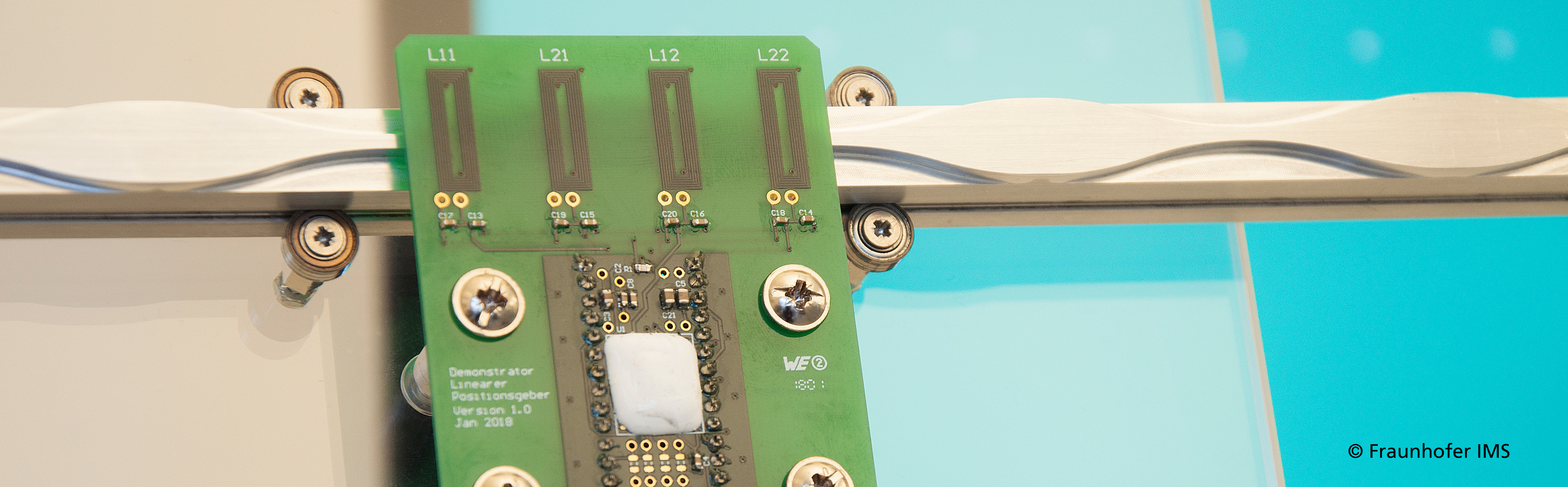 Sensor design with four PCB coils, metallic target with sine track and the position sensor ASIC