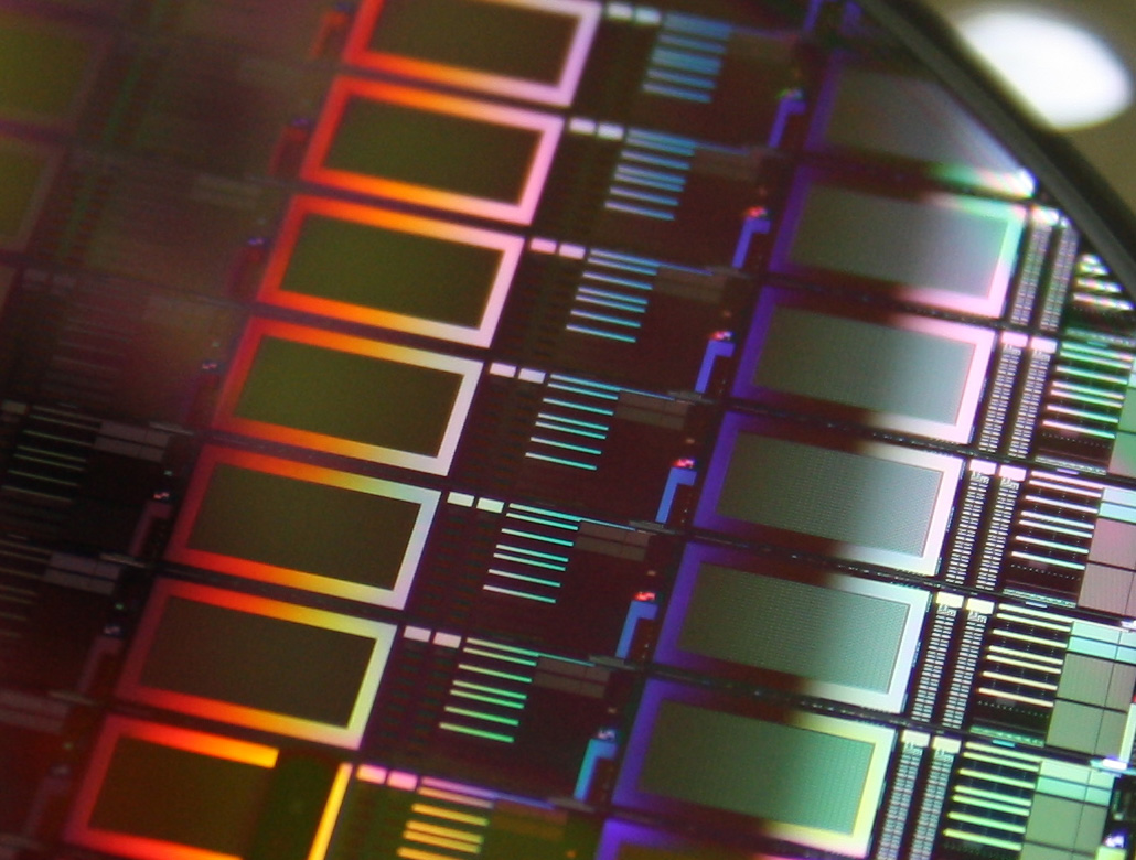 A fraction of a silicon wafer with integrated CMOS-SPADs is shown 